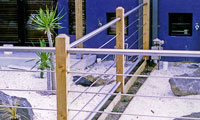 Stainless steel and timber fence