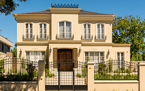 THis french provinial villa has arched fluer de deis spear heads for its panels, pedestrian gate and automatic sliding driveway gate.