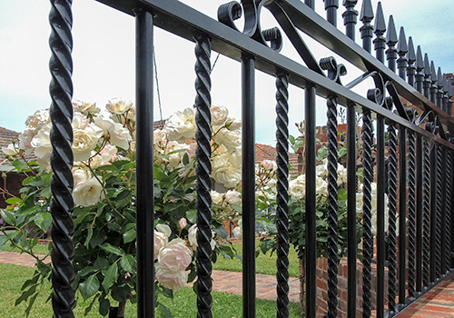 Wrought iron panel with twistred bars and scrolls